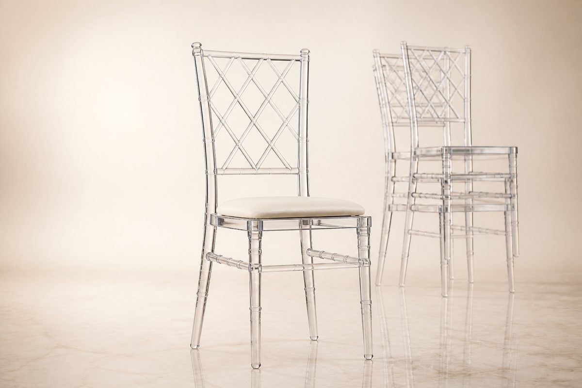 Clear acrylic resin chiavari chair with ivory cushion on a studio background